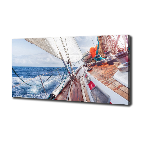 Canvas foto Een zeilboot op zee