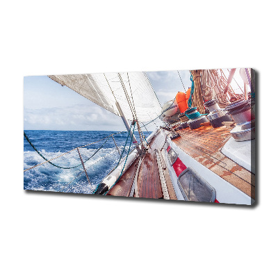 Canvas foto Een zeilboot op zee