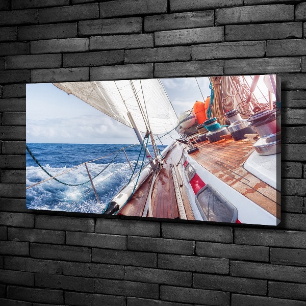 Canvas foto Een zeilboot op zee