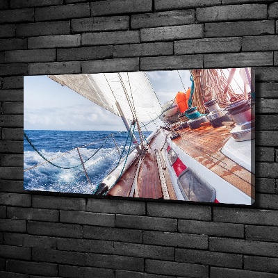 Canvas foto Een zeilboot op zee