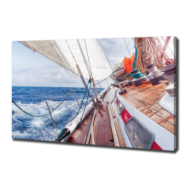 Canvas foto Een zeilboot op zee