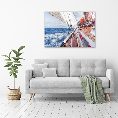 Canvas foto Een zeilboot op zee
