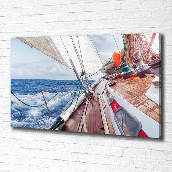 Canvas foto Een zeilboot op zee