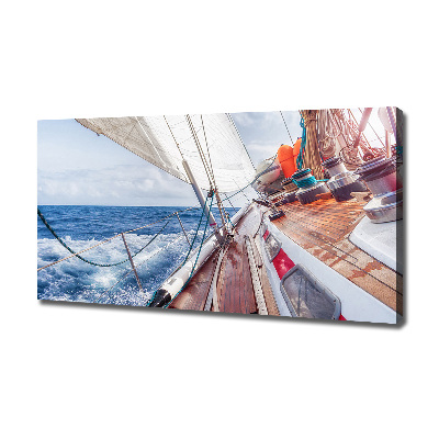 Canvas foto Een zeilboot op zee
