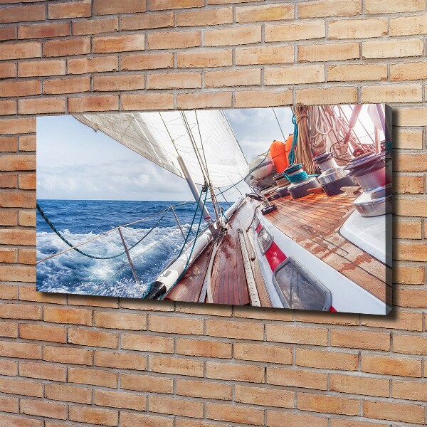 Canvas foto Een zeilboot op zee