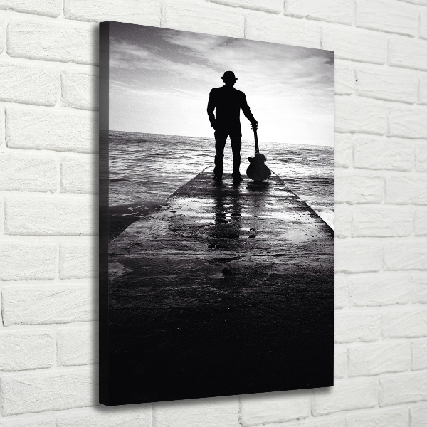 Verticaal schilderij op canvas Gitarist op de pier