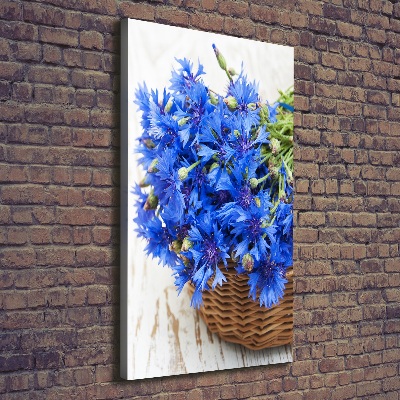 Verticale foto op canvas Korenbloemen in een mand