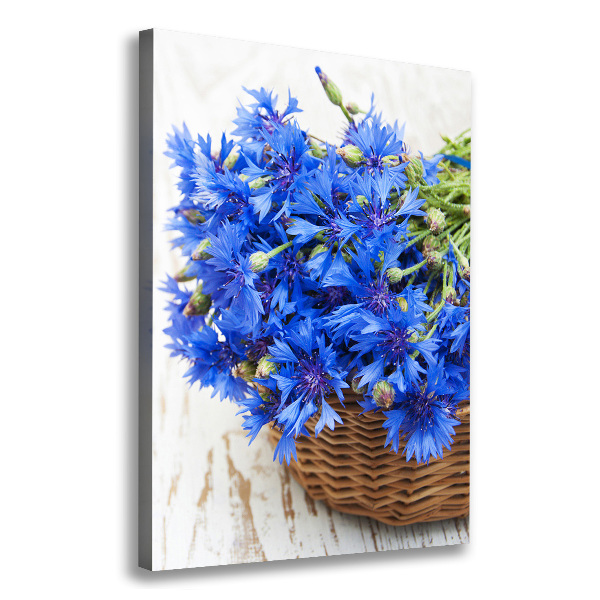 Verticale foto op canvas Korenbloemen in een mand