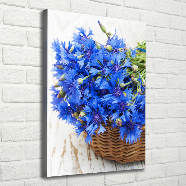 Verticale foto op canvas Korenbloemen in een mand