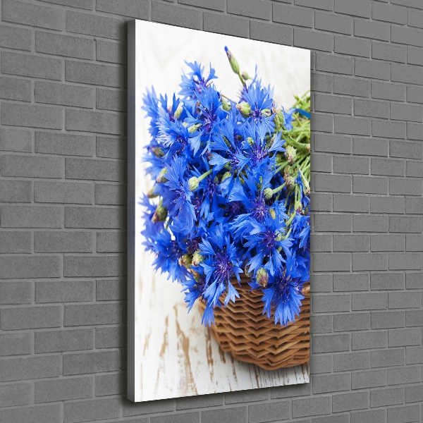 Verticale foto op canvas Korenbloemen in een mand