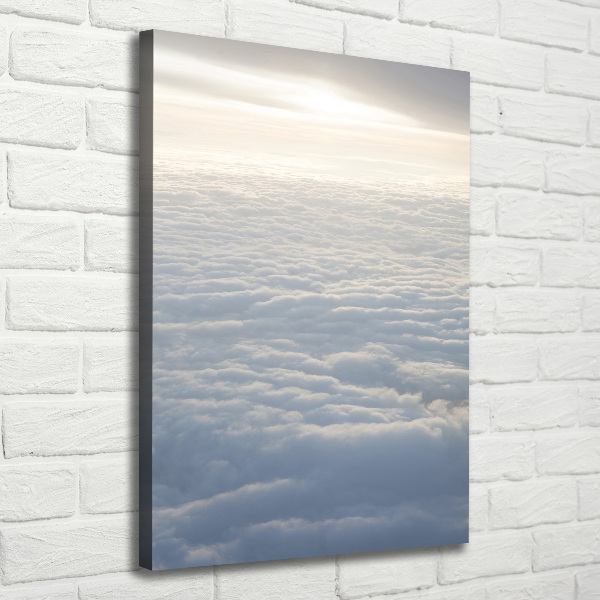 Verticaal schilderij op canvas Vliegen boven de wolken