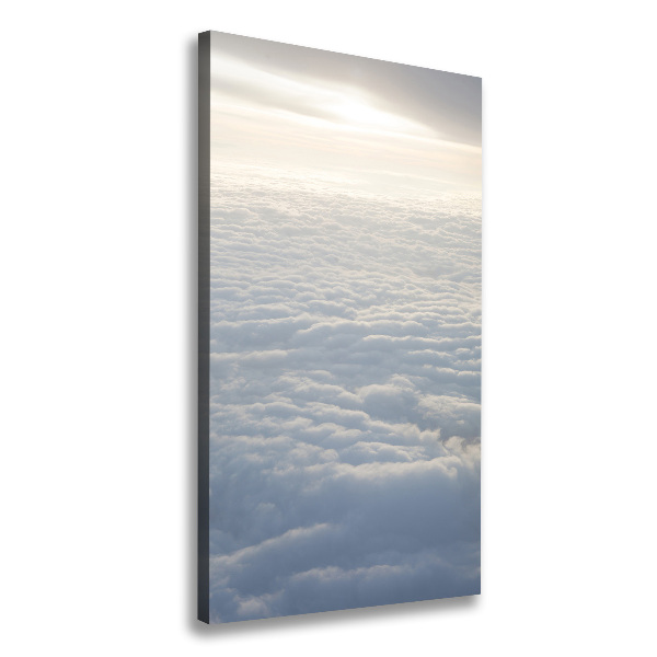 Verticaal schilderij op canvas Vliegen boven de wolken