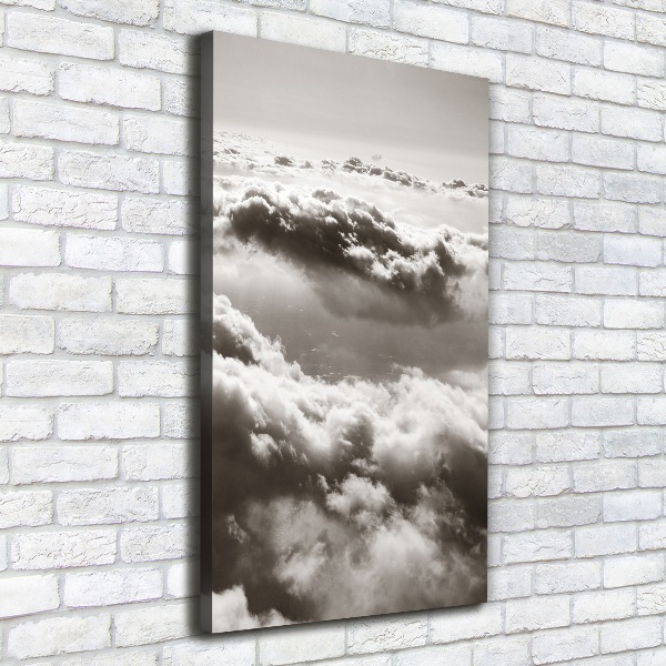 Verticaal canvasschilderij Vliegen boven de wolken