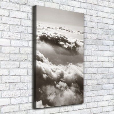 Verticaal canvasschilderij Vliegen boven de wolken