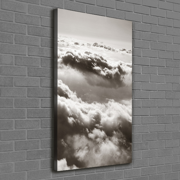 Verticaal canvasschilderij Vliegen boven de wolken