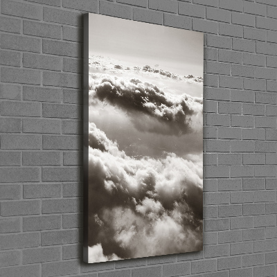 Verticaal canvasschilderij Vliegen boven de wolken