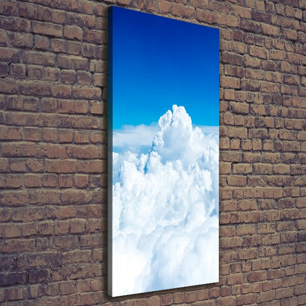 Verticaal canvasschilderij Vliegen boven de wolken