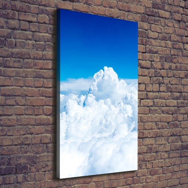 Verticaal canvasschilderij Vliegen boven de wolken