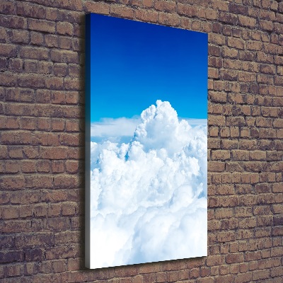 Verticaal canvasschilderij Vliegen boven de wolken