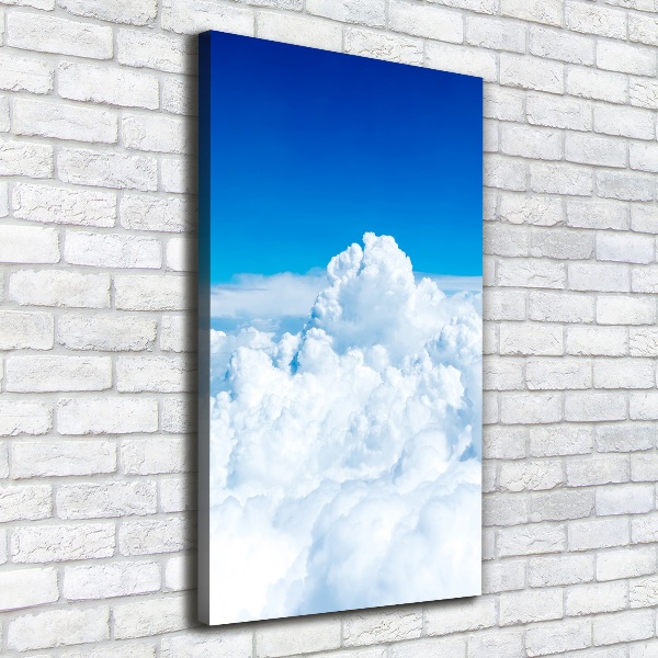 Verticaal canvasschilderij Vliegen boven de wolken