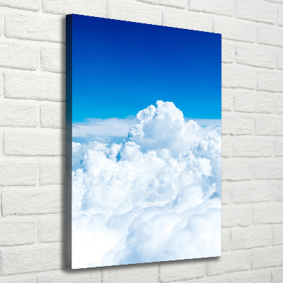 Verticaal canvasschilderij Vliegen boven de wolken