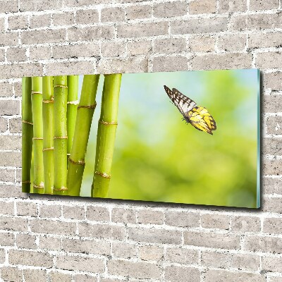 Foto schilderij op glas Bamboe en vlinder