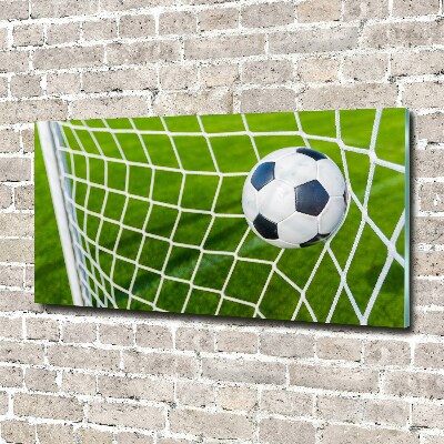 Schilderij glas De bal ligt in het doel.
