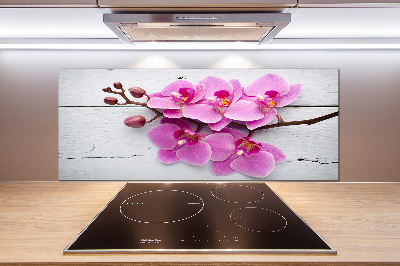 Glazen achterwand keuken Orchidee op hout