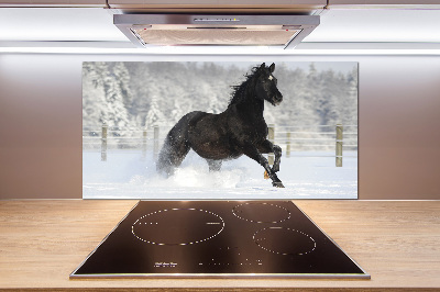 Achterwand keuken Een paard dat galoppeert in de sneeuw