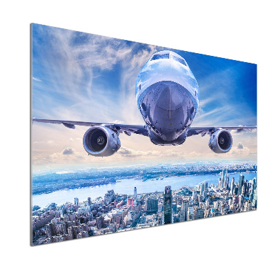 Keuken achterwand Een vliegtuig boven de stad