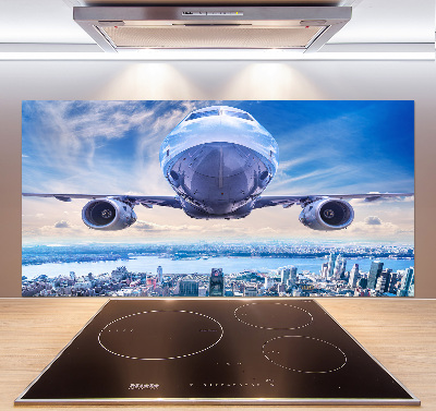 Keuken achterwand Een vliegtuig boven de stad