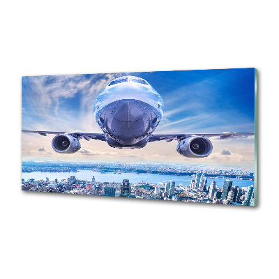 Keuken achterwand Een vliegtuig boven de stad