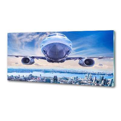 Keuken achterwand Een vliegtuig boven de stad