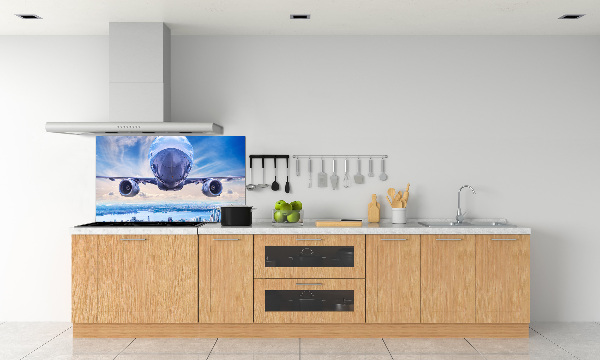Keuken achterwand Een vliegtuig boven de stad