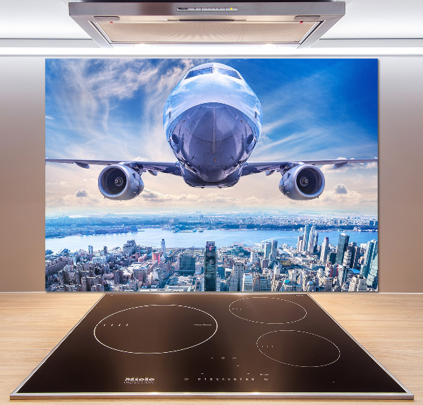 Keuken achterwand Een vliegtuig boven de stad