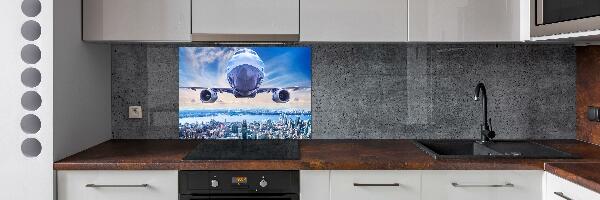 Keuken achterwand Een vliegtuig boven de stad