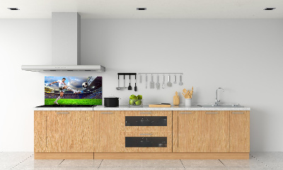 Glazen achterwand keuken Een voetballer in het stadion.