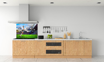 Glazen achterwand keuken Een voetballer in het stadion.