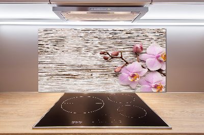 Glazen achterwand keuken Orchidee op hout