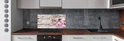 Glazen achterwand keuken Orchidee op hout
