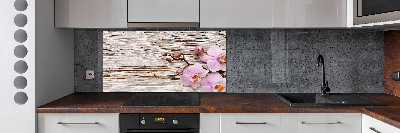 Glazen achterwand keuken Orchidee op hout