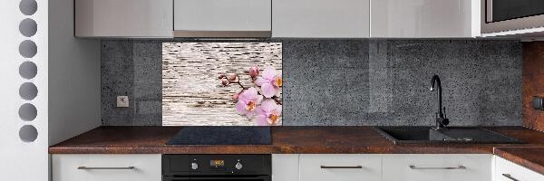 Glazen achterwand keuken Orchidee op hout