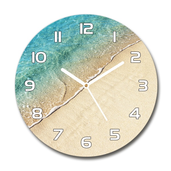 Ronde glas klok Een golf op het strand