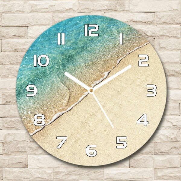 Ronde glas klok Een golf op het strand