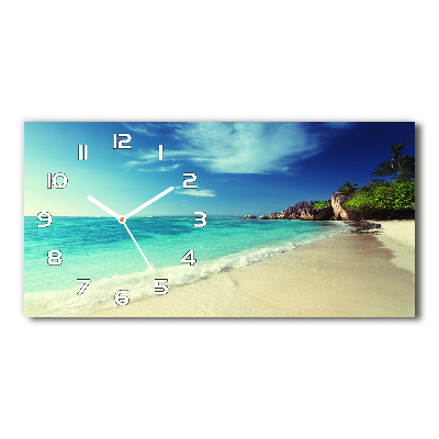 Langwerpige wandklok van glas strand op de Seychellen