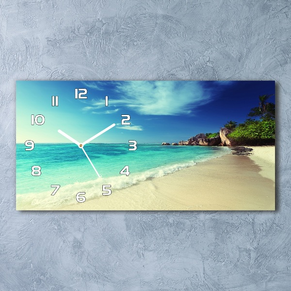 Langwerpige wandklok van glas strand op de Seychellen
