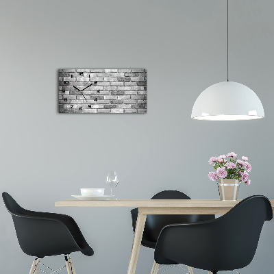 Langwerpige wandklok van glas Bakstenen muur