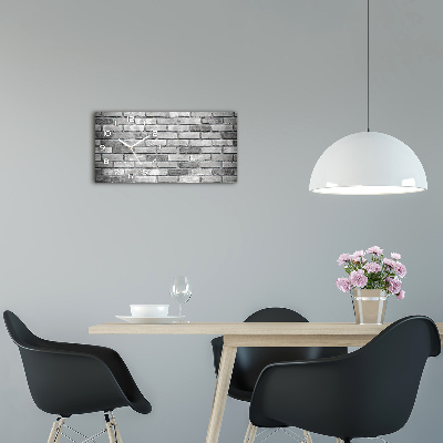 Langwerpige wandklok van glas Bakstenen muur