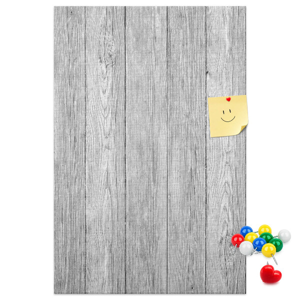 Kurken prikbord met een achtergrond van grijze houten planken