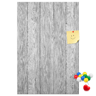 Kurken prikbord met een achtergrond van grijze houten planken